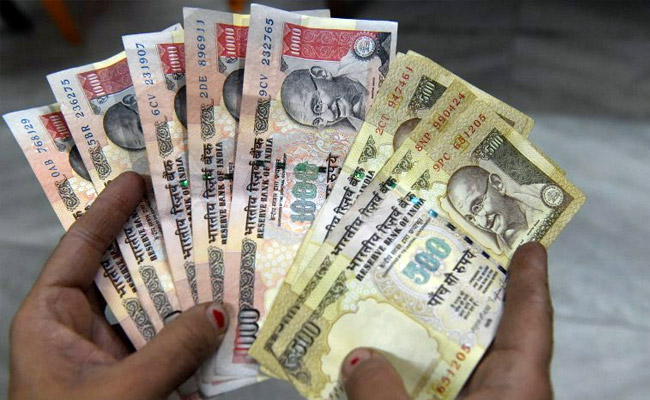 Rupee firms up 12 paise as dollar slips overseas