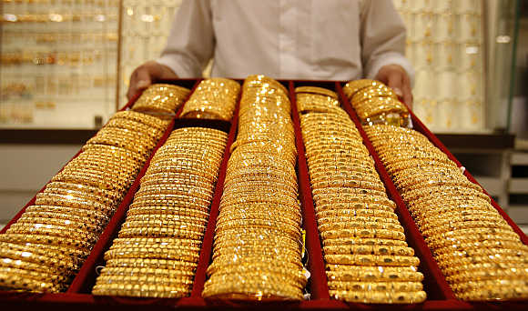 Gold extends losses; down Rs 50 on weak demand