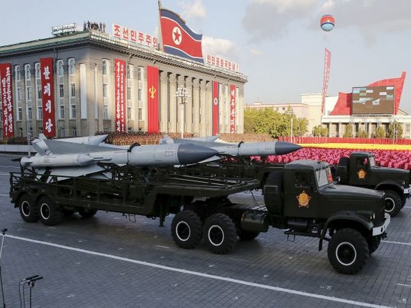North Korea parades military might, warns US
