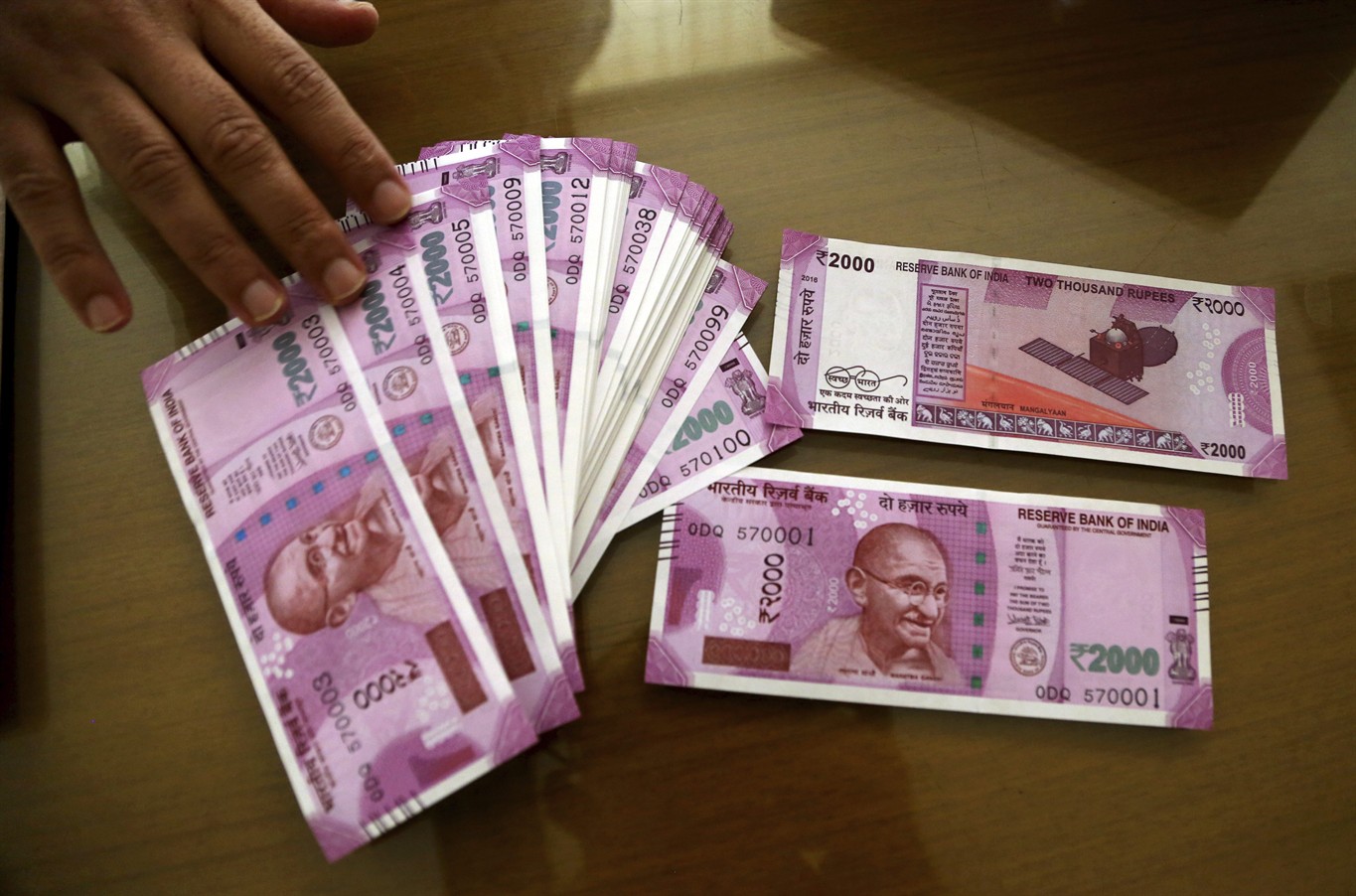 Rupee edges up 3 paise against dollar