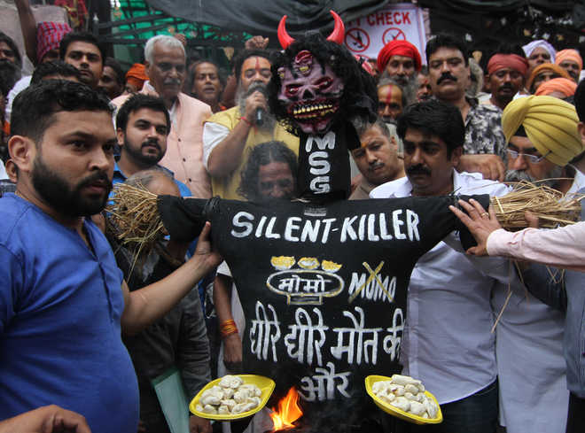 BJP legislator leads protest against 'momos', demands ban