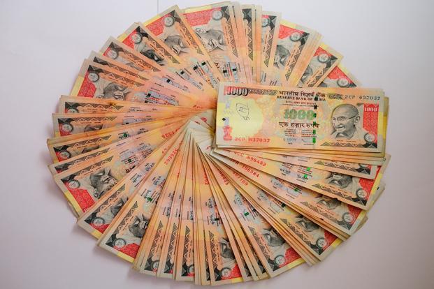 Rupee gains 14 paise against dollar in early trade