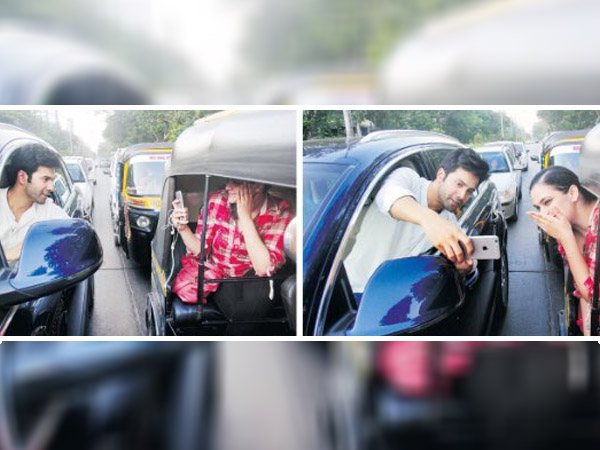 Mumbai Police challans Varun Dhawan for taking selfie with a fan on the road