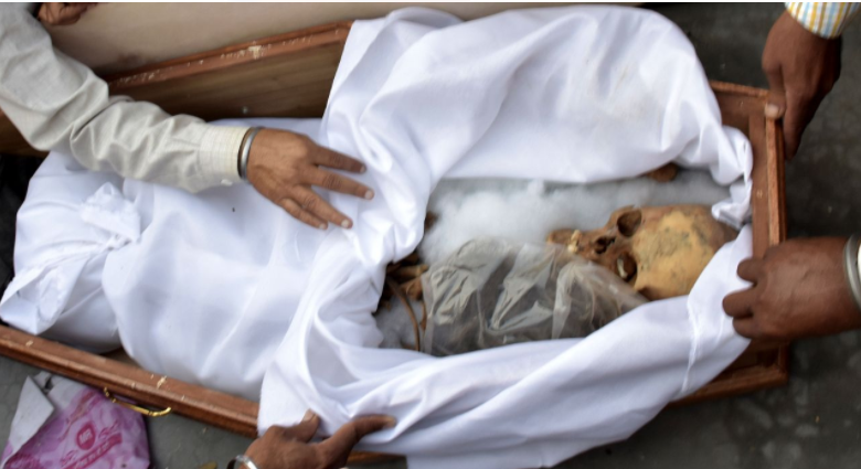 Instead of boxes full of gifts, families open Caskets with skeletons as 'Remains' of loved ones