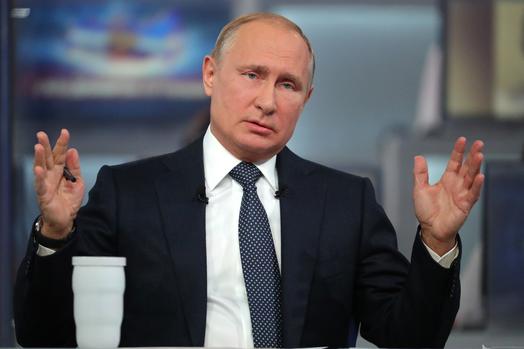 Putin takes aim at West in marathon phone-in