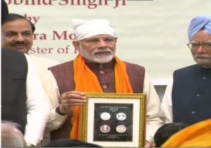 Prime Minister Narendra Modi releases commemorative coin in  honour of Sri Guru Gobind Singh Ji