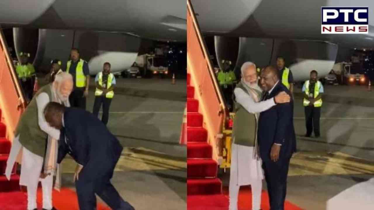 Papua New Guinea's PM greets Prime Minister Modi by touching his feet