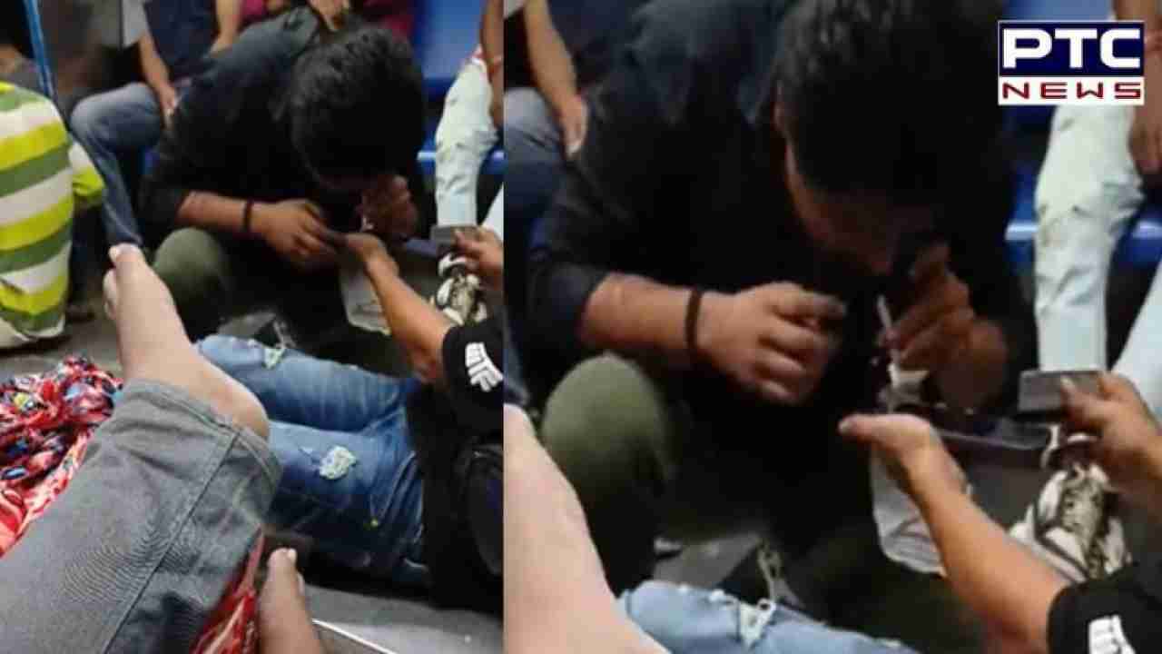 Viral video: Man allegedly consumes drugs on Mumbai local, Railway responds