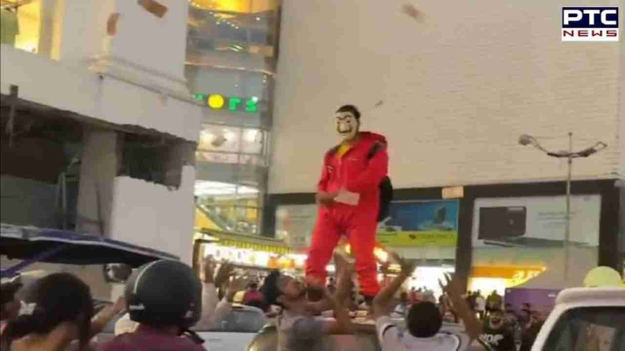 Watch | Jaipur witnessed its 'Money Heist' moment as masked man showers notes in the air