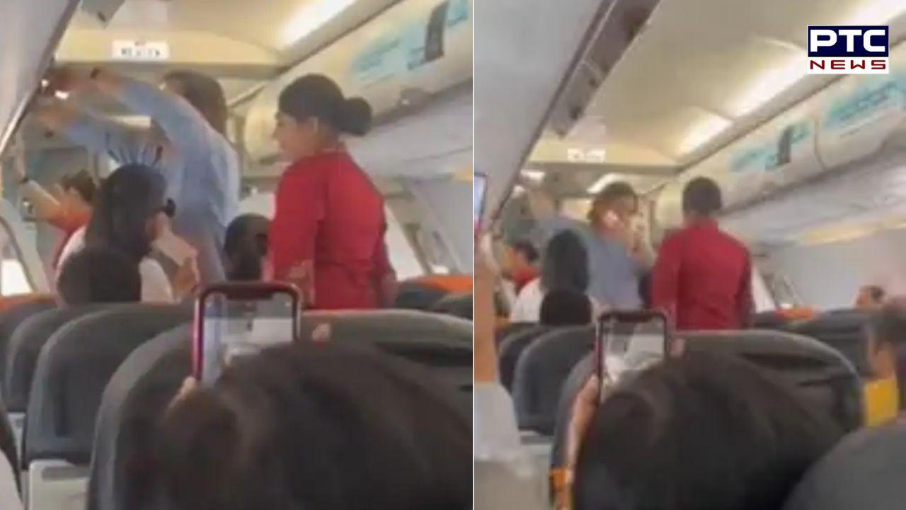 Dhoni boards economy class flight, leaves co-passengers awestruck | Watch