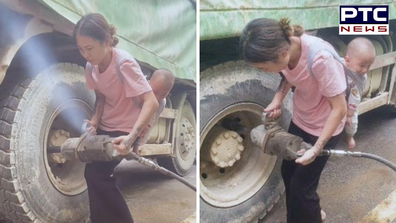 VIDEO : ਹੌਂਸਲੇ ਨੂੰ ਸਲਾਮ, ਬੱਚੇ ਨੂੰ ਆਪਣੀ ਪਿੱਠ 'ਤੇ ਬੰਨ੍ਹਕੇ ਟਰੱਕ ਦਾ ਟਾਇਰ ਬਦਲ ਰਹੀ ਹੈ ਔਰਤ !
