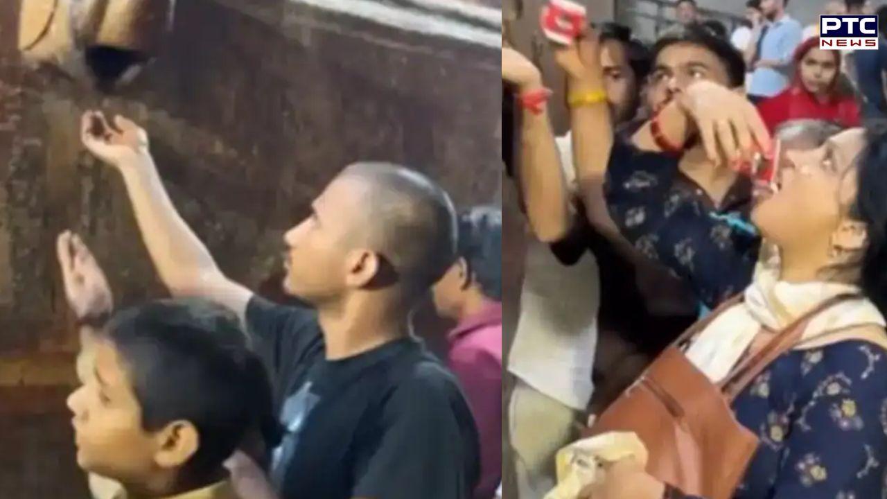 Banke Bihari Mandir devotees drink AC water believing it to be 'Charan Amrit' | WATCH