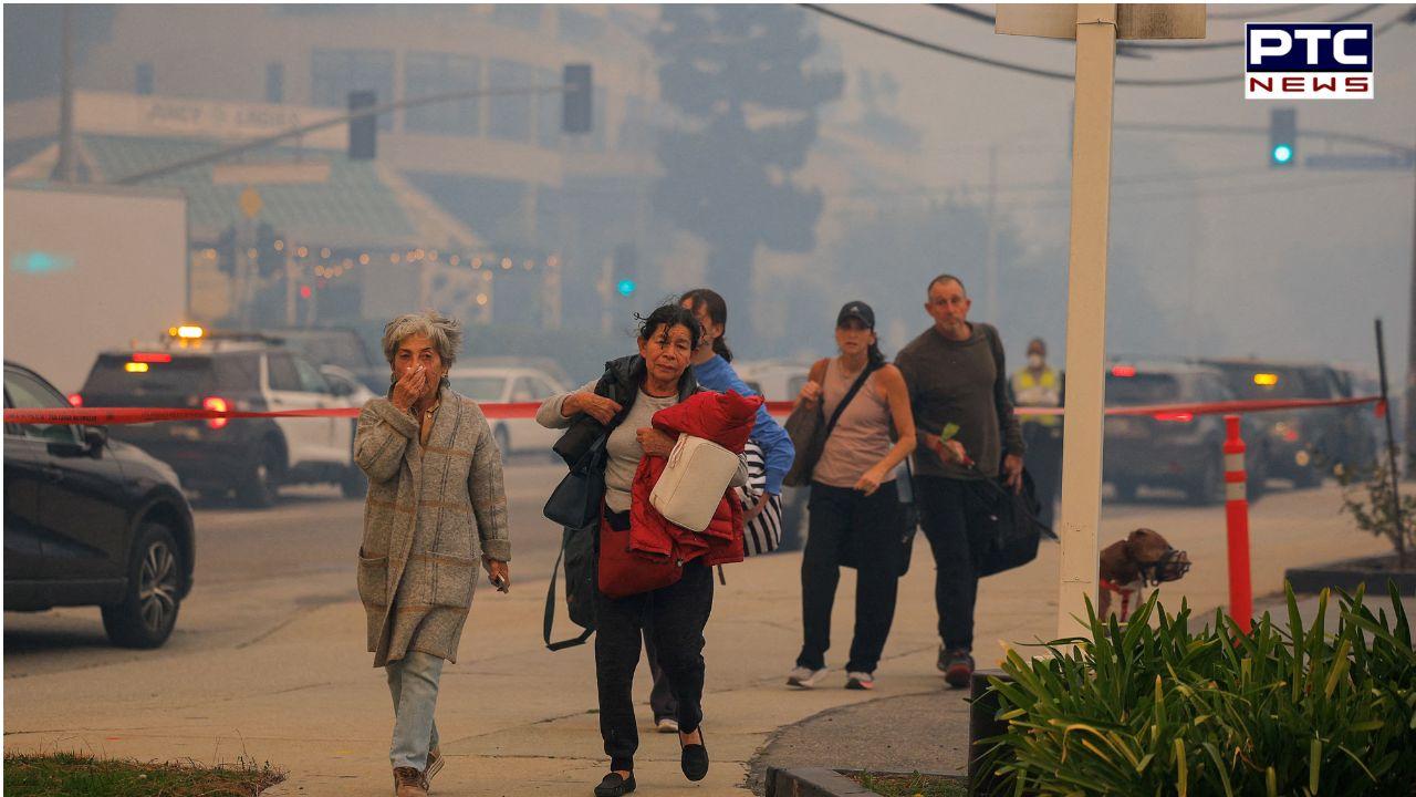 California wildfires turn Los Angeles skies orange, thousands forced to evacuate