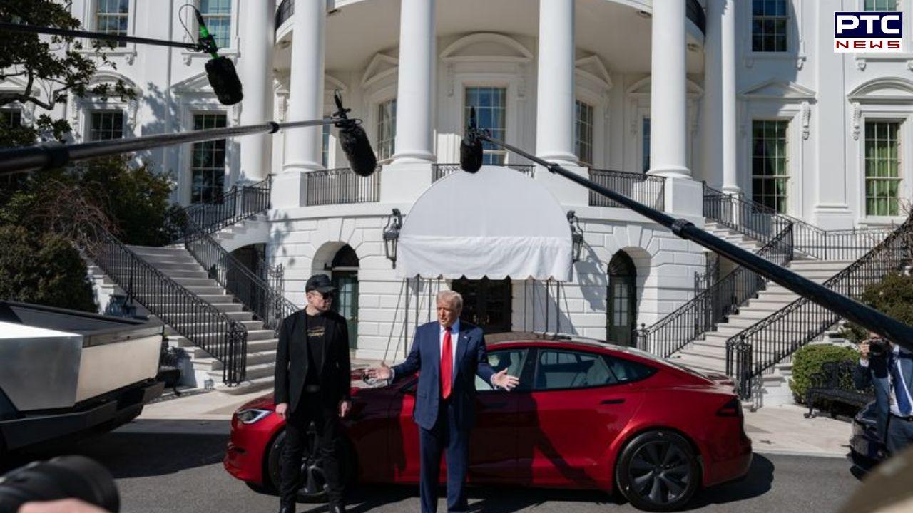 Donald Trump picks 'beautiful' red Tesla at White House alongside Musk